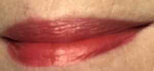 The Organic Skin Company Lip Service Lipstick in shade Flame, a neutral-toned true red, neversaydiebeauty.com