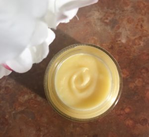 jar of Character Secret Agent Body Balm open to show the whipped golden balm, neversaydiebeauty.com