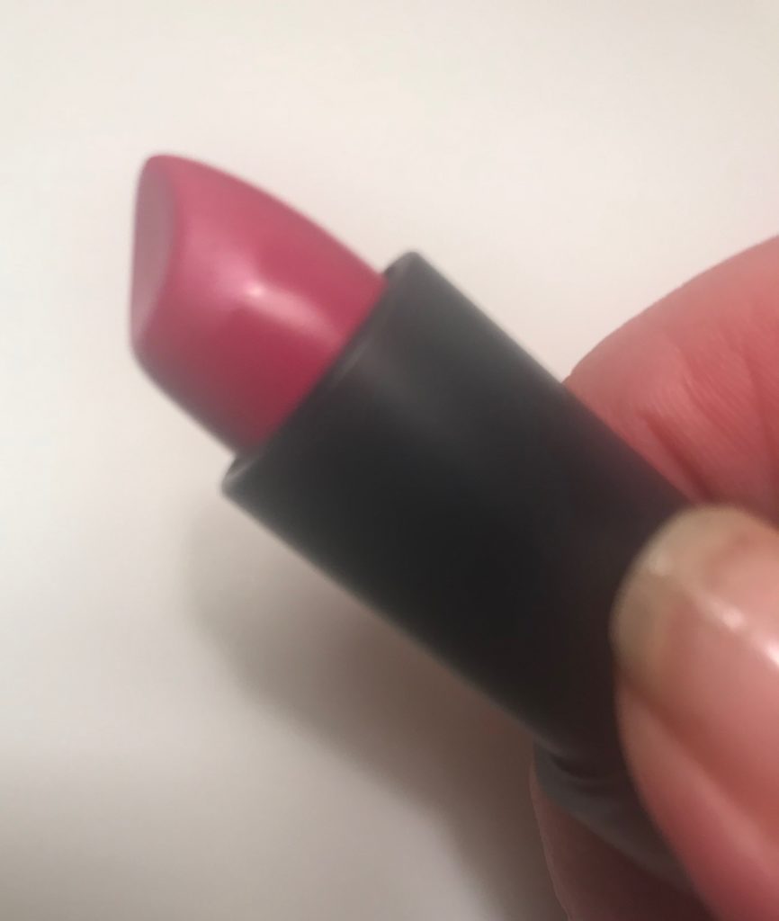 the unique curved shape of the Lip Service Lipstick bullet, The Organic Skin Company, neversaydiebeauty.com