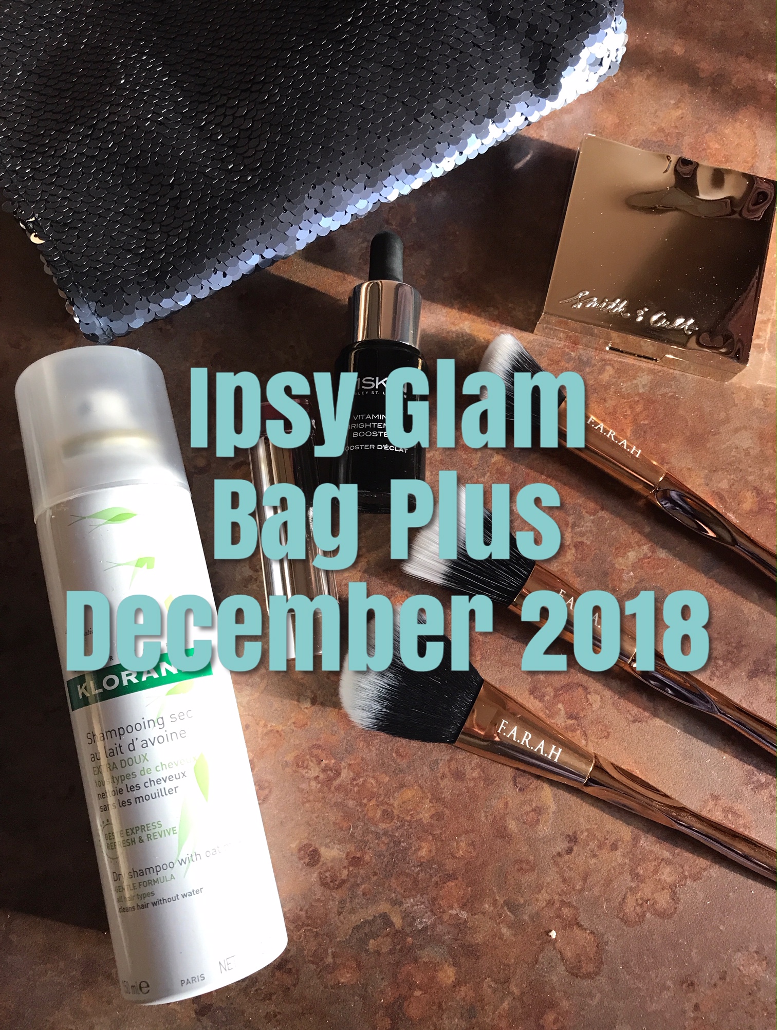 Ipsy Glam Bag Plus cosmetics for December 2018 with title on front, neversaydiebeauty.com