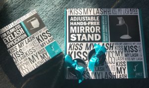 Good Janes Kiss My Lash 3 way mirror and stand with two rounded beribboned boxes of false lashes, neversaydiebeauty.com