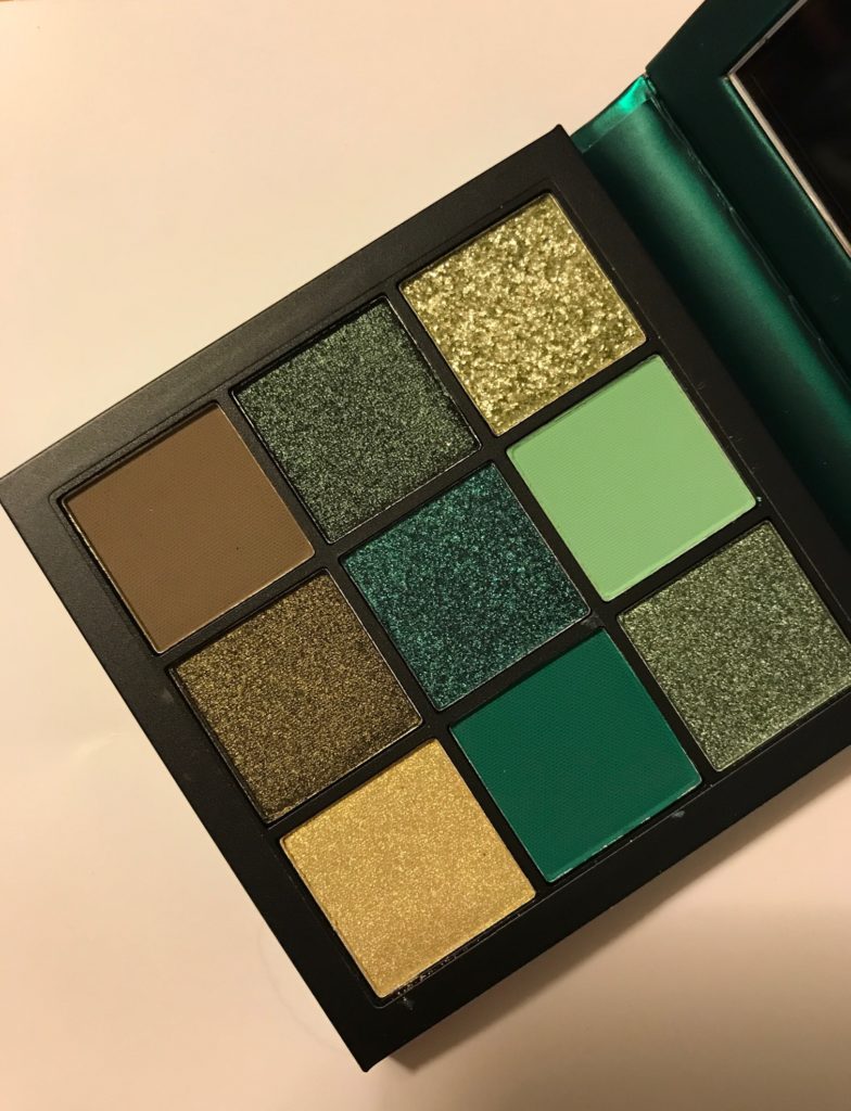 closeup of the shades in the Huda Beauty Emerald Obsessions eyeshadow palette, neversaydiebeauty.com