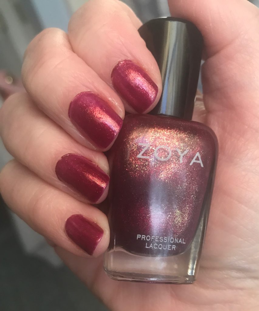 my nails wearing cranberry red with gold shimmer, Teigen, from Zoya, neversaydiebeauty.com