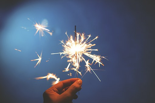 photo of a hand holding a sparkler