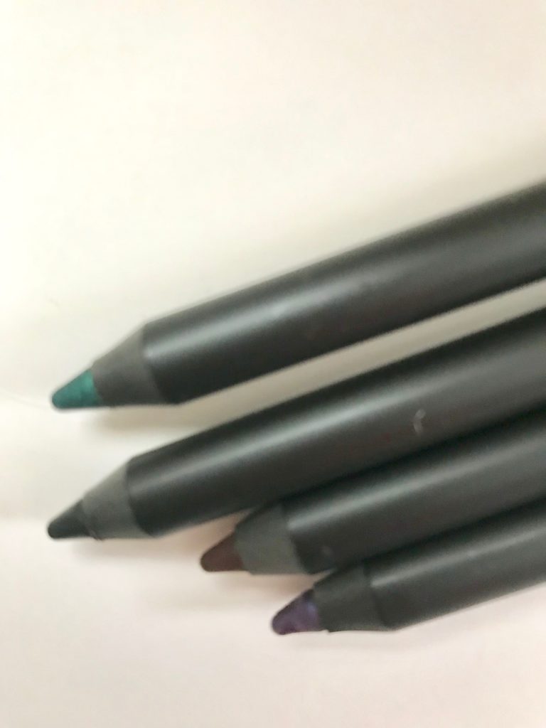 closeup of the tips of Mally Evercolor Starlight Waterproof Eyeliner pencils in Caribbean Sea, Midnight, Royal Plum & Espresso, neversaydiebeauty.com