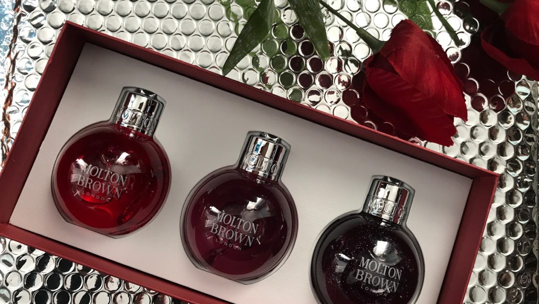 inside the Molton Brown Festive Bauble Set with 3 2.5 fl. oz. "ornaments" with shower gels: Pink Pepper, Frankincense & Allspice and Muddled Plum, neversaydiebeauty.com