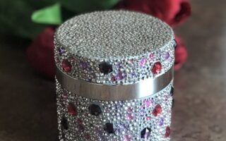 crystal encrusted jar of PRAI Throat & Decolletage Cream, neversaydiebeauty.com