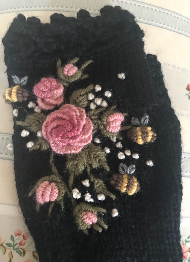 closeup of the embroidery on the black wool fingerless glove from NB Gloves and Mittens, neversaydiebeauty.com