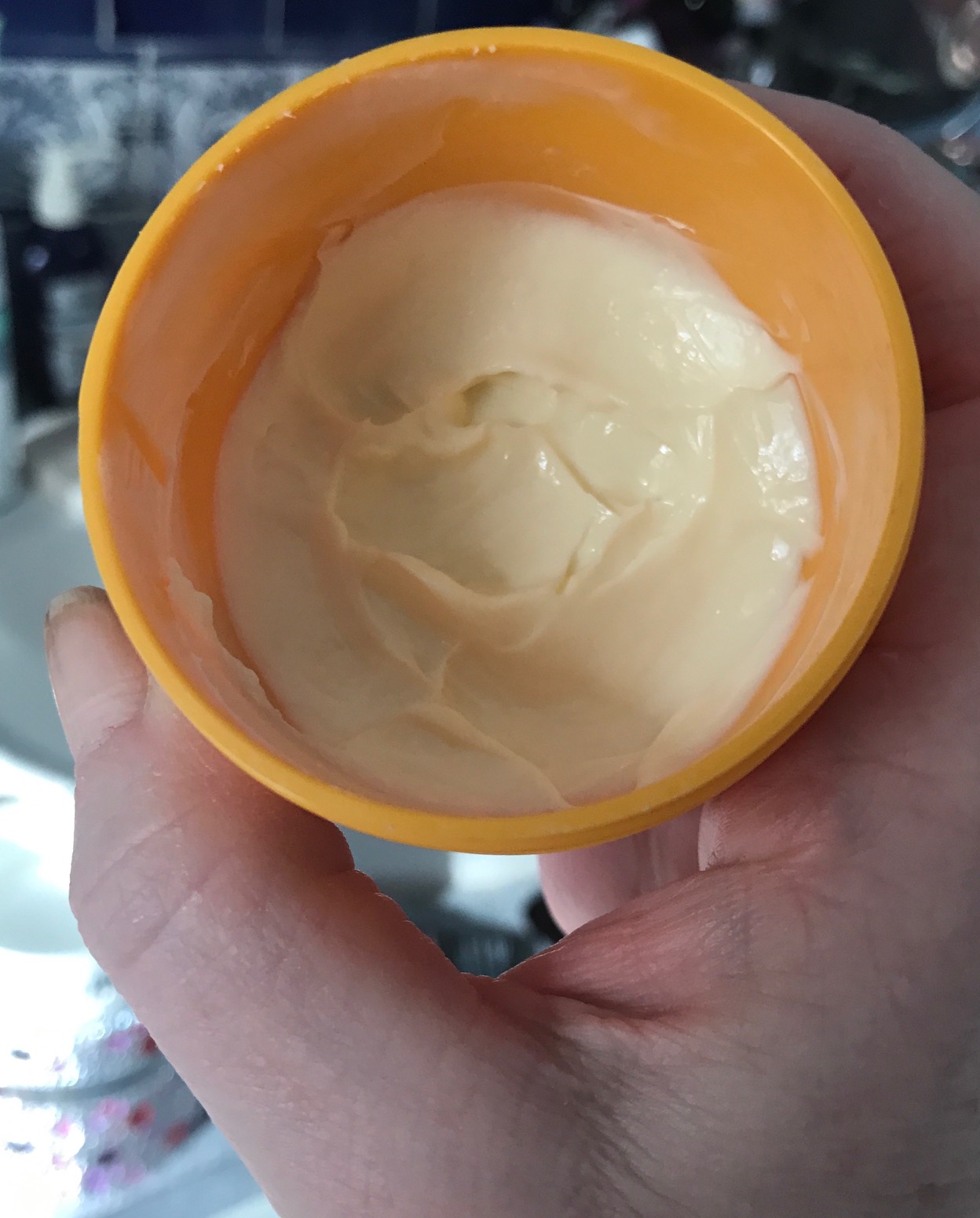 the cream inside the tub of Sol de Janeiro Bum Bum Cream, neversaydiebeauty.com