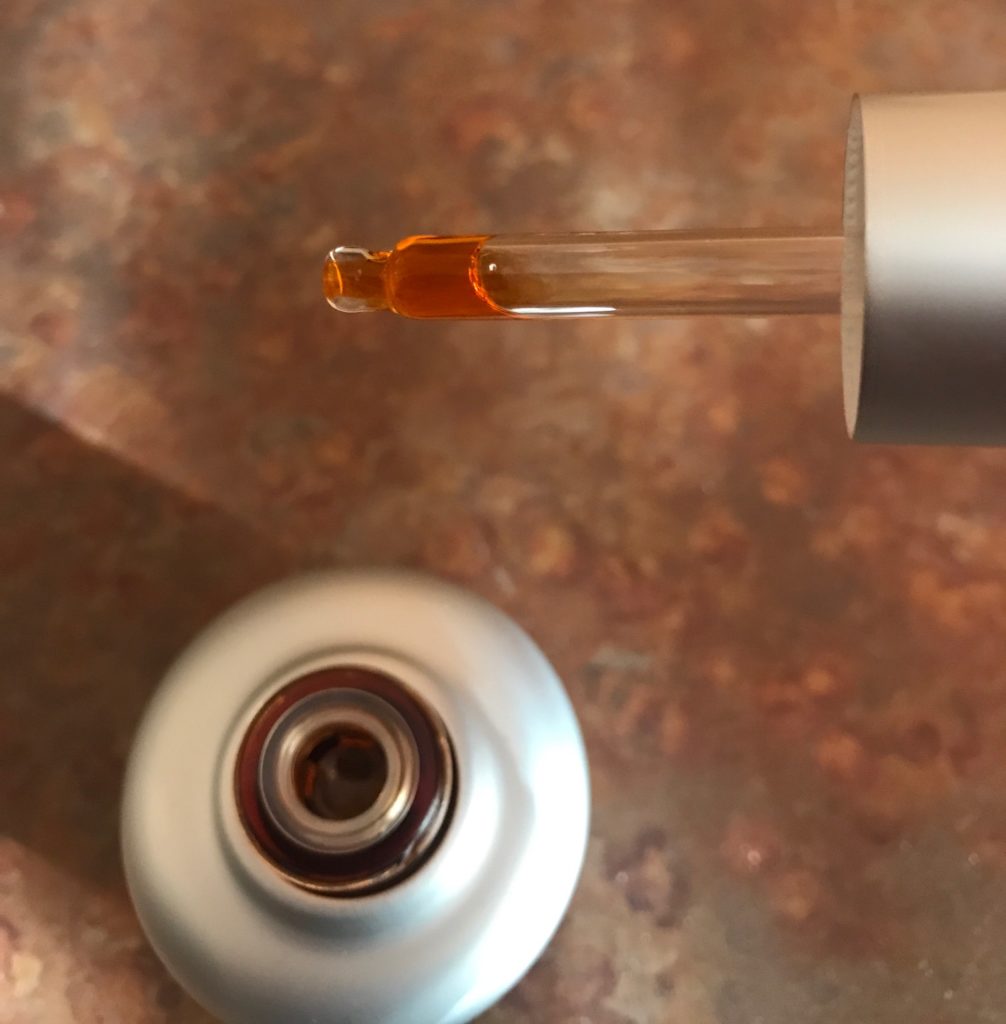 glass dropper with orange oil: StriVectin STAR Retinol Light Night Oil, neversaydiebeauty.com