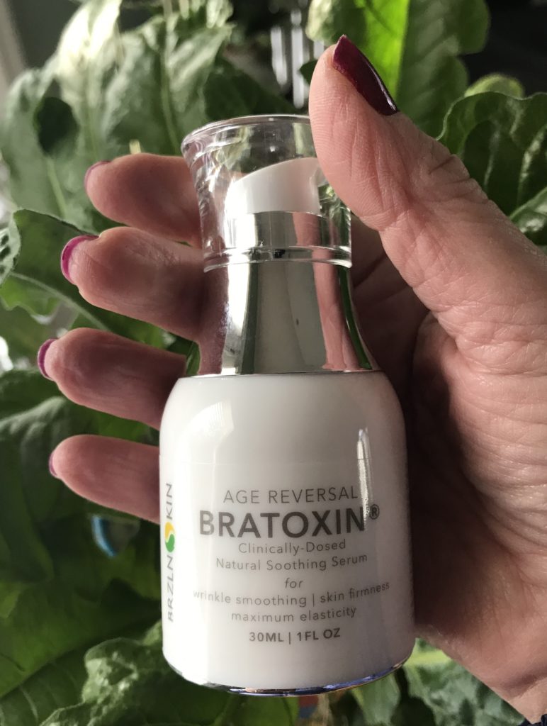 closeup of the white pump bottle of Bratoxin, anti-aging face serum, neversaydiebeauty.com