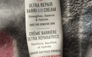 travel size tube of First Aid Beauty Ultra Repair BarriAIR Cream that I used up, neversaydiebeauty.com