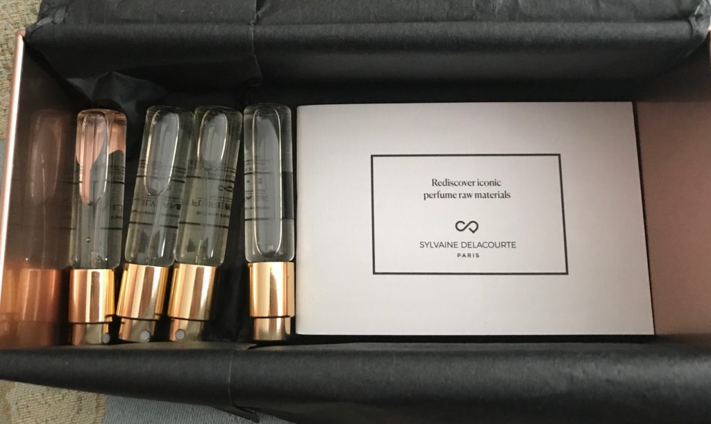glass spray vials of Sylvaine Delacourte Paris perfume and booklet describing the scents, neversaydiebeauty.com
