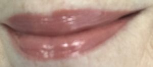 lip swatch of Pucker, a peachy-mauve shade of Social Paint Lip Gloss, neversaydiebeauty.com