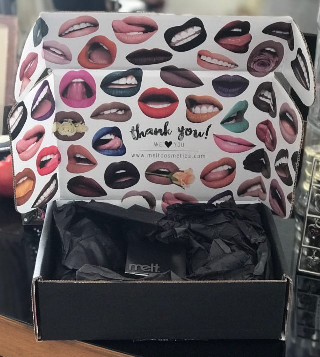 open shipping box from Melt Cosmetics showing the interior with lips, neversaydiebeauty.com