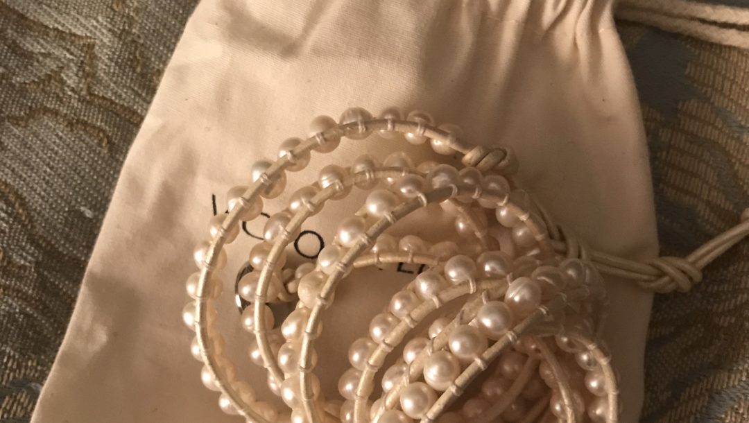 freshwater pearls on ivory leather wrap bracelet on a cotton pouch, neversaydiebeauty.com