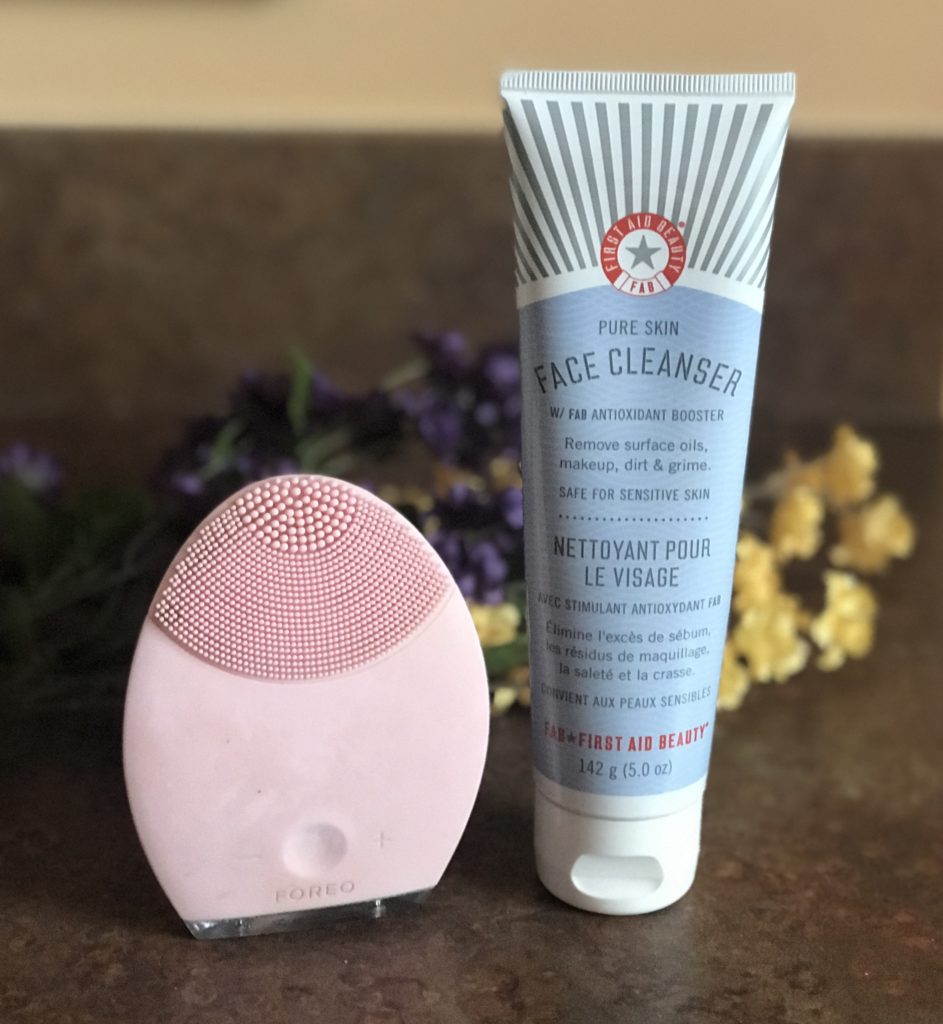 Foreo Luna face cleansing tool and tube of First Aid Beauty Pure Skin Face Cleanser, neversaydiebeauty.com