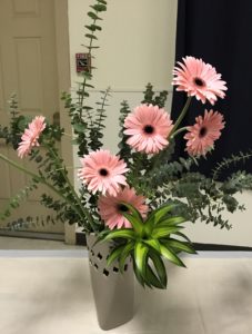 Ikebana arrangement with pink Gerbera daisies and greenery, neversaydiebeauty.com