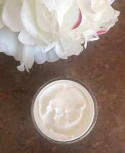 open jar of PRAI Potent-C Power Cream with Copper showing the fluffy, light white cream, neversaydiebeauty.com
