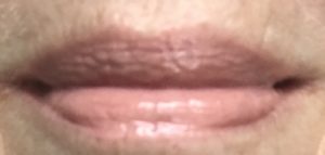 lip swatch of my lips wearing opaque Pink Nude City Lips Plumping Lip Gloss, neversaydiebeauty.com