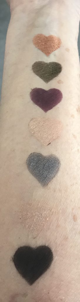 swatches of pans 6-12 in natural light from Physicians Formula Sultry Nights palette, neversaydiebeauty.com