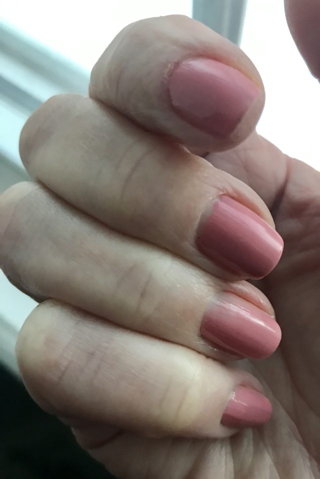 my nails wearing Milani Pink Beige nail polish after using Bitter Gold Nail Serum, neversaydiebeauty.com