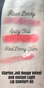 swatches of Clarins Joli Rouge Velvet Lipsticks in Rose Berry and Spicy Chili and Instant Light Lip Comfort Oil in Red Berry Glam, neversaydiebeauty.com