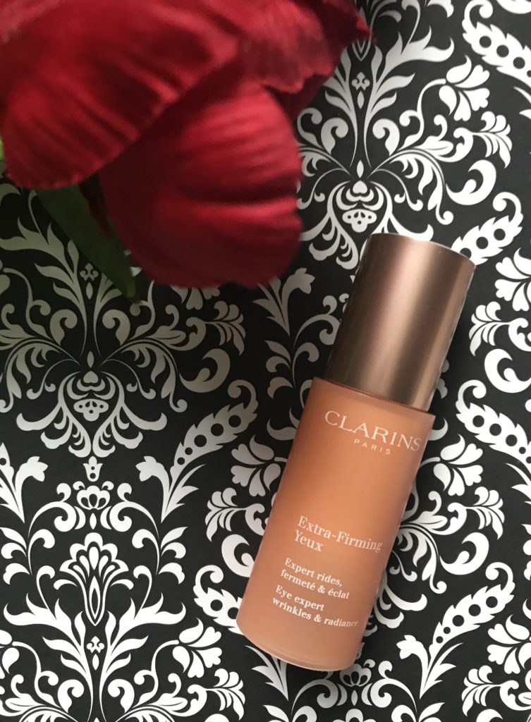 peach-colored bottle of Clarins Extra-Firming Eye, neversaydiebeauty.com
