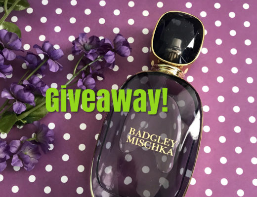 purple glass faceted bottle of Badgley Mischka Eau de Parfum with giveaway written on the photo, neversaydiebeauty.com
