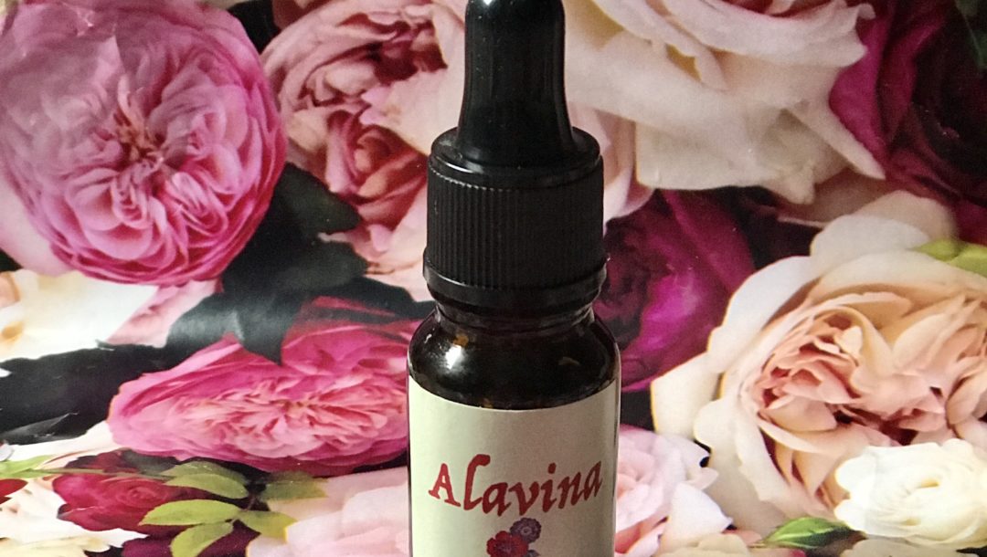 bottle of organic Alavina Nourishing Face Oil against a floral background, neversaydiebeauty.com