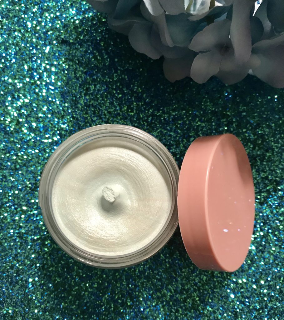 jar of Algenist Alive Prebiotic Balancing Mask open to show the pale mint green thick cream inside