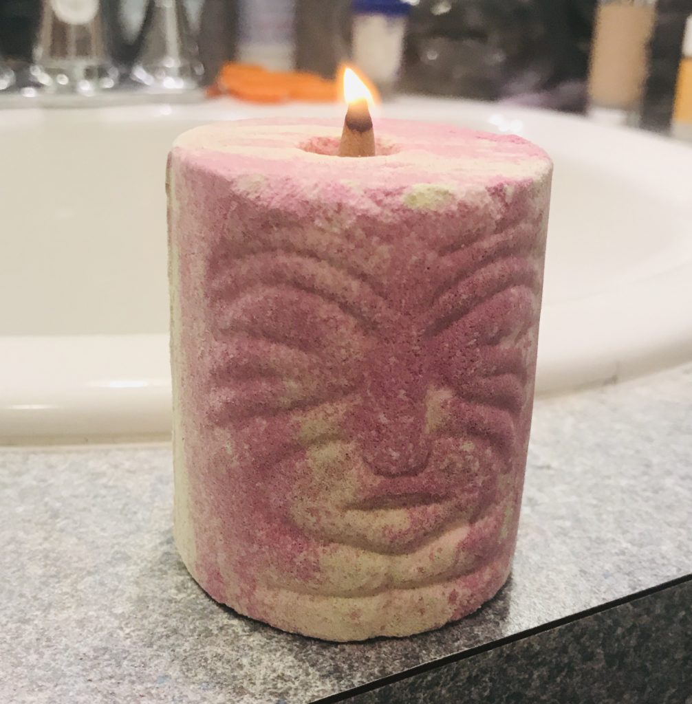 HALLU Mermaid Tiki Toch bath bomb with the wick at the top light up