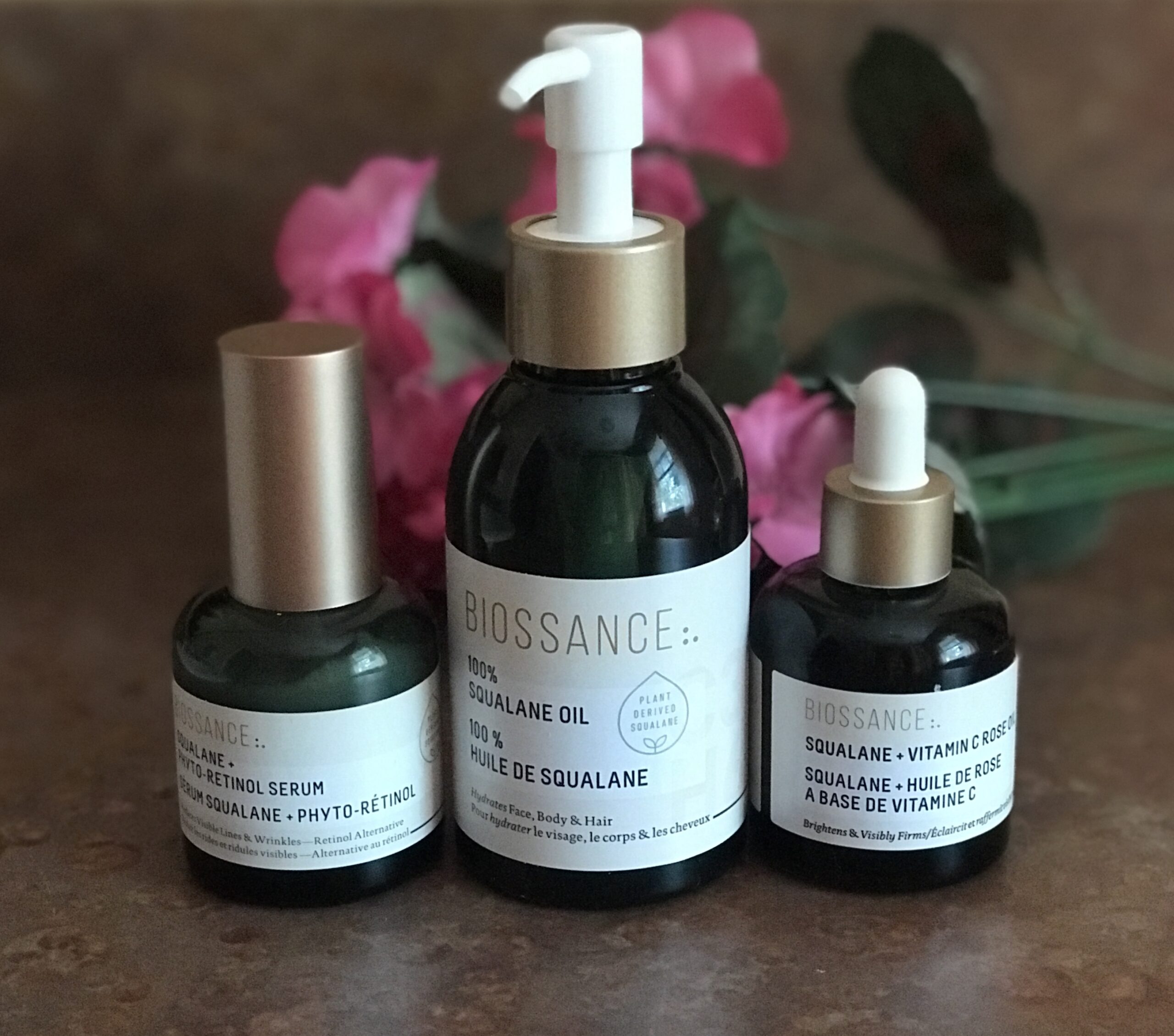 3 bottles of Biossance squalane skincare products: Phyto-Retinol, Squalane Oil & Vitamin C Rose Oil