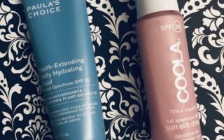 tube of Paula's Choice Youth Extending Hydrating Fluid SPF 50 and bottle of Coola Sun Silk Drops SPF 30