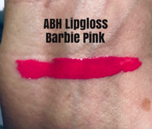 swatch of hot pink Anastasia Beverly Hill lipgloss in the shade, Barbie Pink