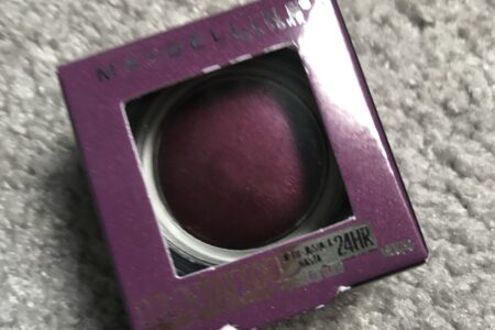 outer packaging of Maybelline Color Tattoo, deep purple shade called Knockout