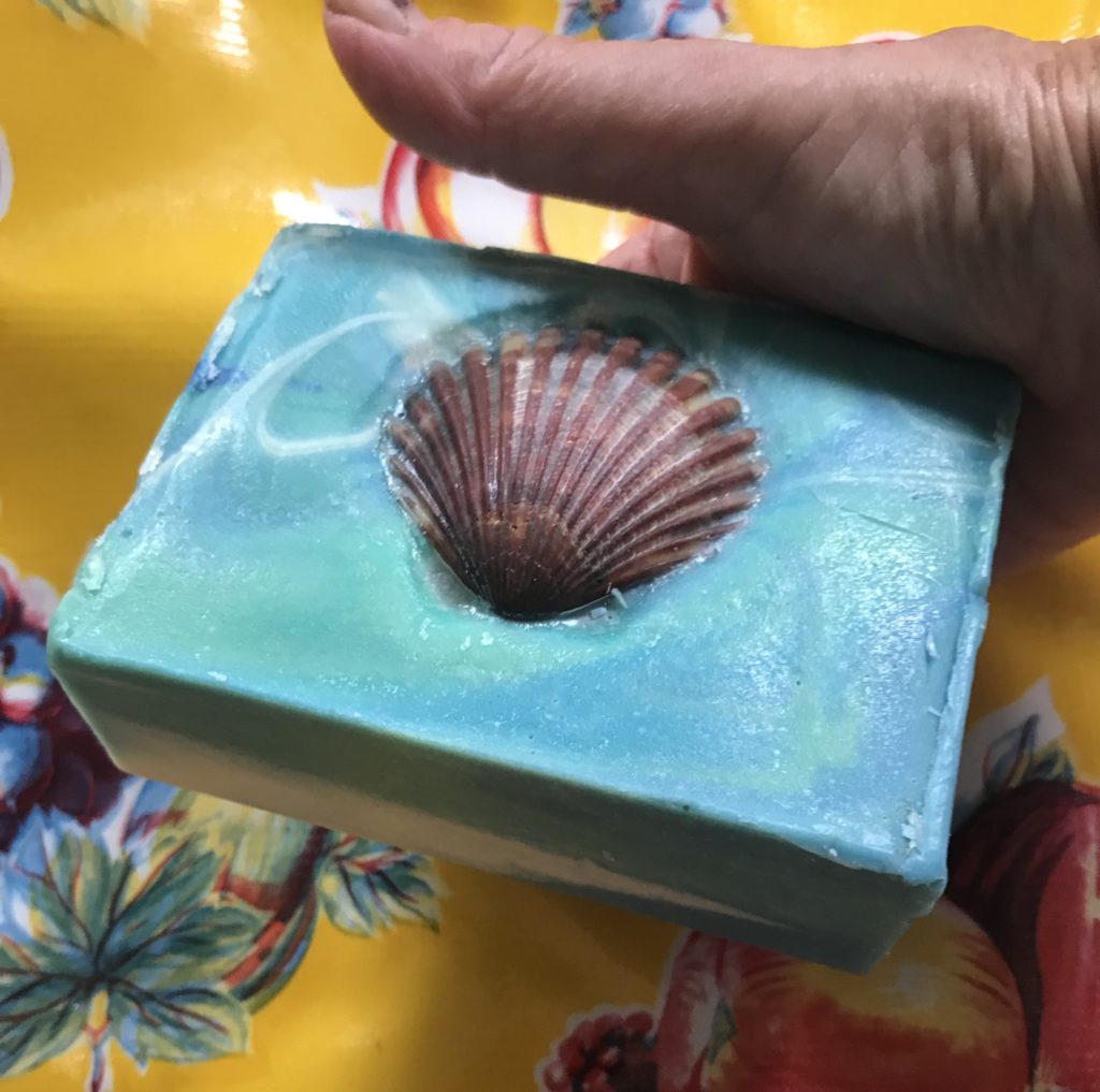 Nature Island Botanicals super large Spa Bar bar soap in shirts of blue and green with a scallop shell on the front of the soap