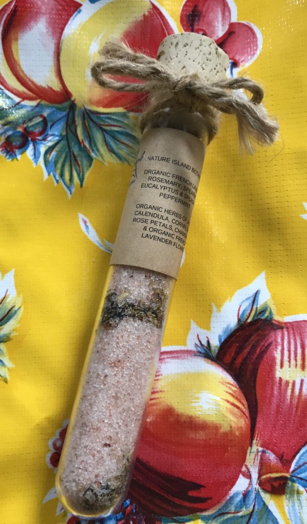 glass tube filled with pink Himalayan Sat and organic herbs and flowers: Nature Island Botanicals Body and Foot Soak