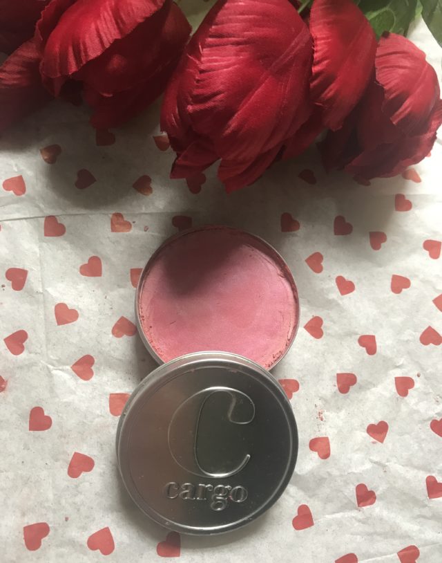 open silver metal container revealing Cargo Swimmables Blush in Bali, a medium rose pink shade