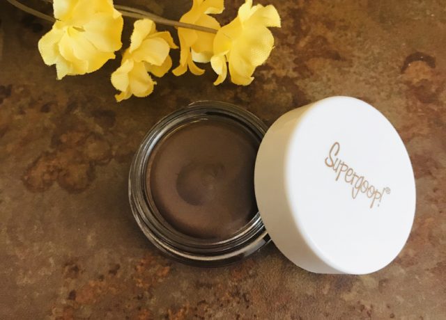 closeup of milk chocolate brown "Sunset", Supergoop Shimmershade Eyeshadow SPF 30 in its glass pot