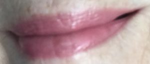 my lips wearing IT Cosmetics lipstick, shade Je Ne Said Quoia, a light pink shade