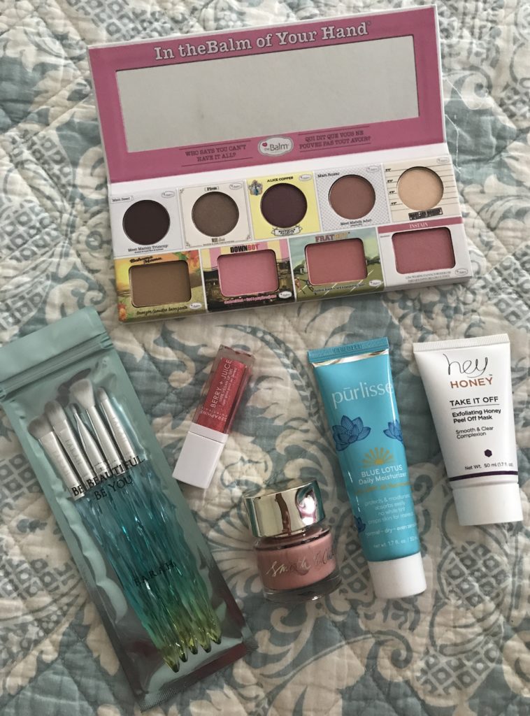 the contents of the cosmetics in my August 2019 Ipsy Glam Bag Plus out of their outer packaging and open to show how they look