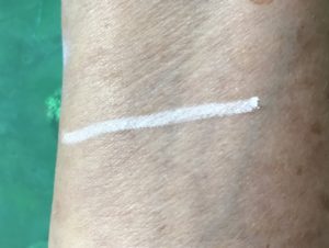 swatch on my arm of Kat Von D white Cake Pencil Eyeliner