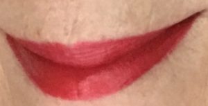 lip swatch in bright sunshine of Pat McGrath BlitzTrance lipstick in the classic red shade, Blood Rush