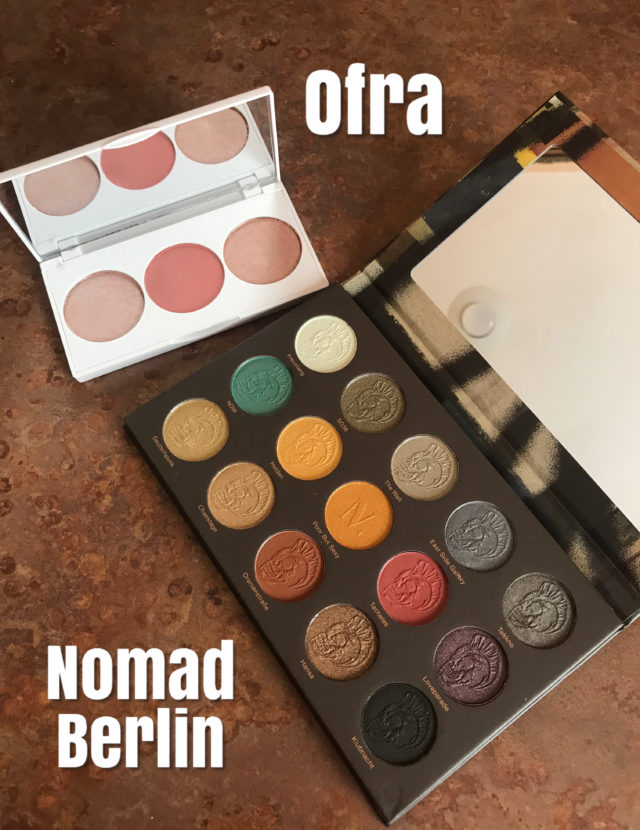 Ofra Madison Miller face palette w 2 highlighters and a pink blush and Nomad Cosmetics Berlin Underground Intense Eyeshadow Palette, both open to show the shades