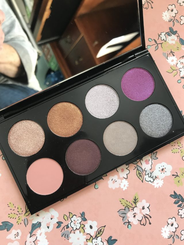 eyeshadow palette open to show the 10 shades of shimmers and mattes