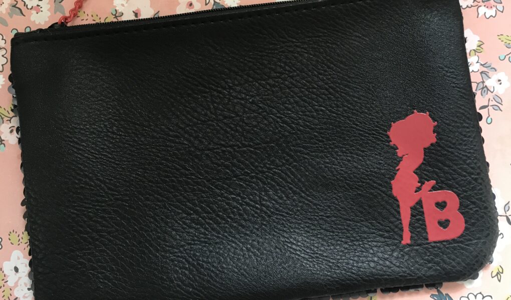 Ipsy Plus Betty Boop makeup bag, black faux leather with red Betty Boop silhouette and letter B