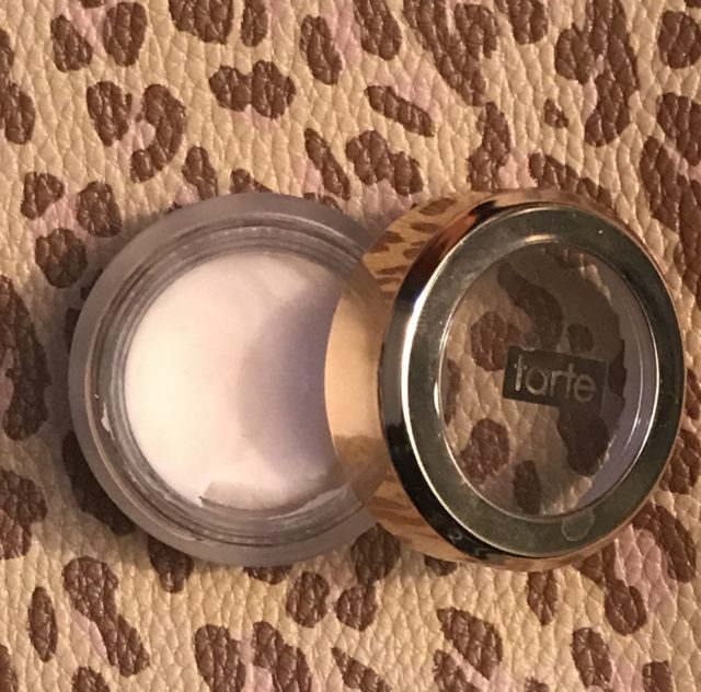 open travel size jar of Tarte Timeless Smoothing Primer to show the pale pink thick cream