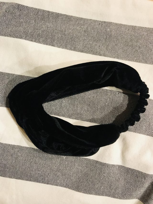 black velvet elasticized headband on striped turkish towel, both gifts with points from Sephora