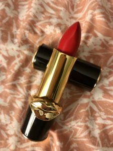 Bullet and tube of Pat McGrath LuxeTrance Lipstick in the warm red shade, McGrath Muse
